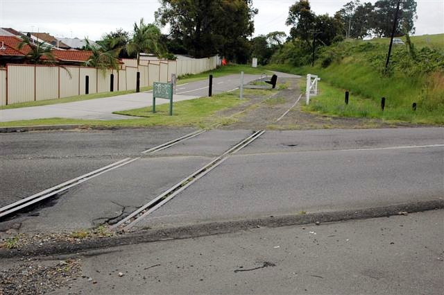 The view looking south where the former Belmont branch line crossed Park Avenue. Apart from the level crossing itself, the rest of the line is now part of the Rail Trail.