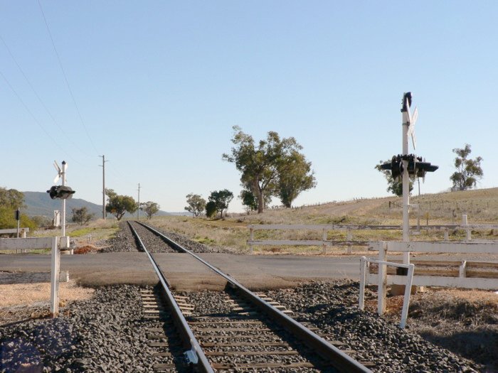 The view looking north. The station was located just beyond the level crossing.