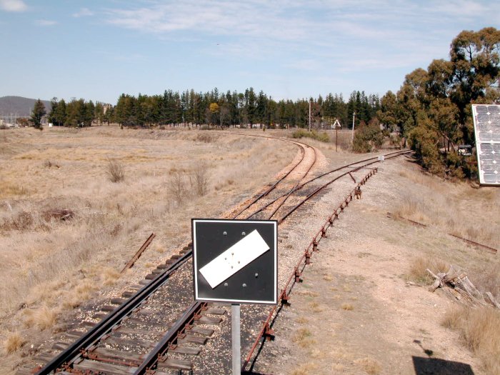 The view looking towards the junction.  The south leg of the triangle is just visible in front of the trees in the background. The south junction is near the white box in the left distance.