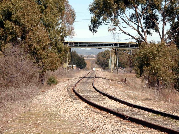 The view looking down the north triangle leg into the Austen and Butta siding.  The structure over the track is a coal conveyor belt.