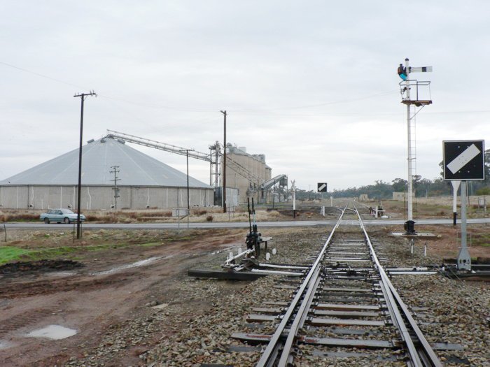 The view looking south. The station is visible on the right of the track in the distance.