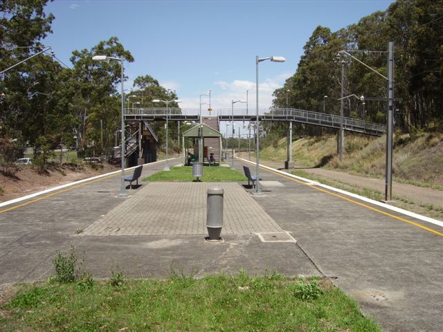 The view looking south, midway along the island platform. The telephone junction post and the paving stones seem to indicate the location of an earlier station building.