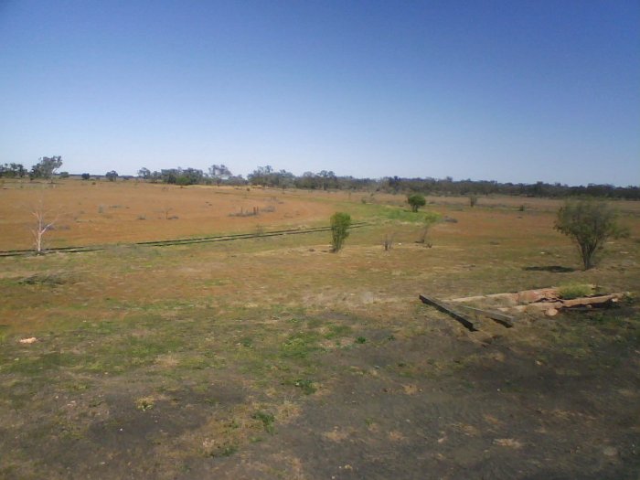 The view looking south over the triangle. The former ash pit is visible in the foreground.