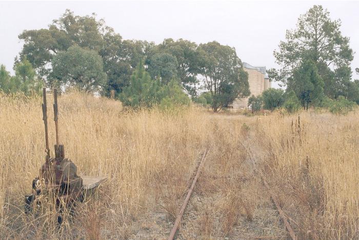 The view looking west from 'E' frame at the eastern end of the Burrumbuttock yard.  The frame is actually outside the yard; the Walbundrie Road crosses the main line and the siding line between the frame and the yard proper.