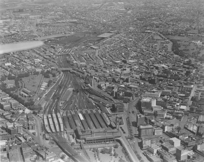 The view looking down from an aeroplane over the Central Station area. In the left foreground are the suburban platforms, with the country platforms on their right. Beyond the second overbridge is Redfern station.

A larger version of this photo is available <a href="/photos/special/central-aerial_photograph_large-oct1931.jpg">here</a>.