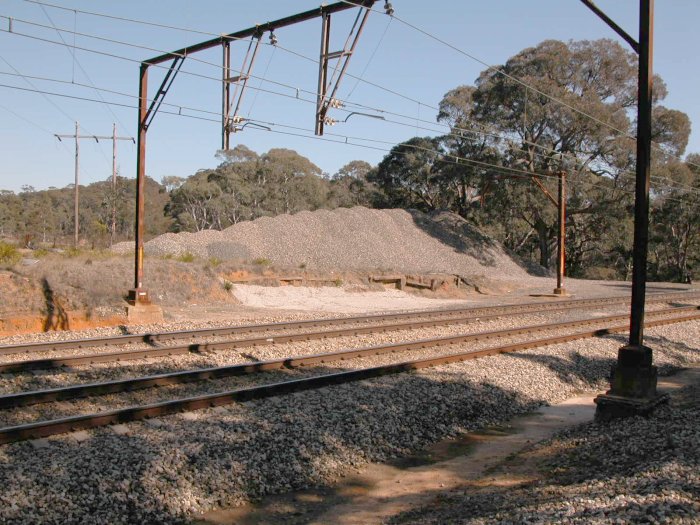 All that is visible is the crumbling remains of the wooden faced goods platform.