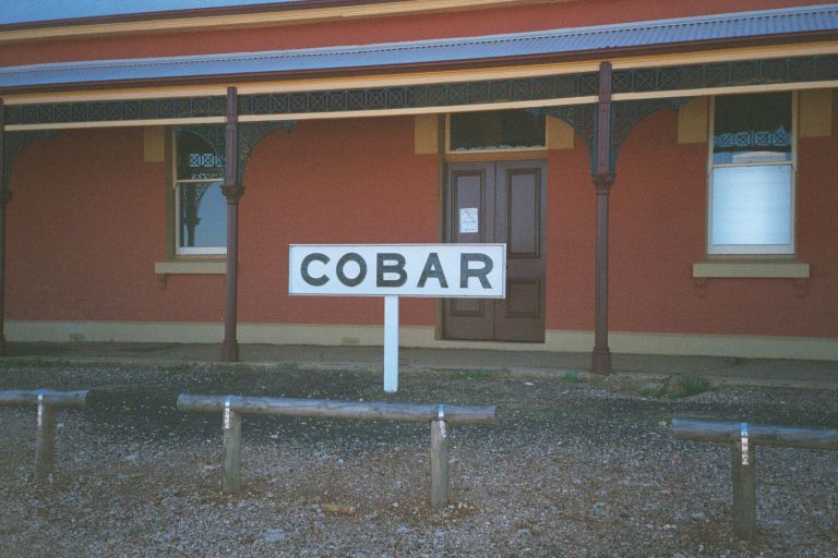 
The station nameboard has been removed from the platform and
placed out the front of the building.
