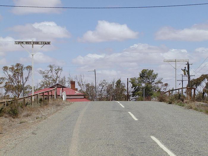 
The level crossing over the old narrow gauge line at Cockburn station.
Despite the sign, trains last ran here in 1969.
