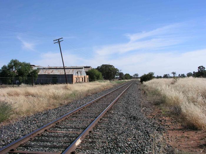 
The view looking south from the one-time station location shows what appears
to be the old meat feezing works, which were served by several sidings.
