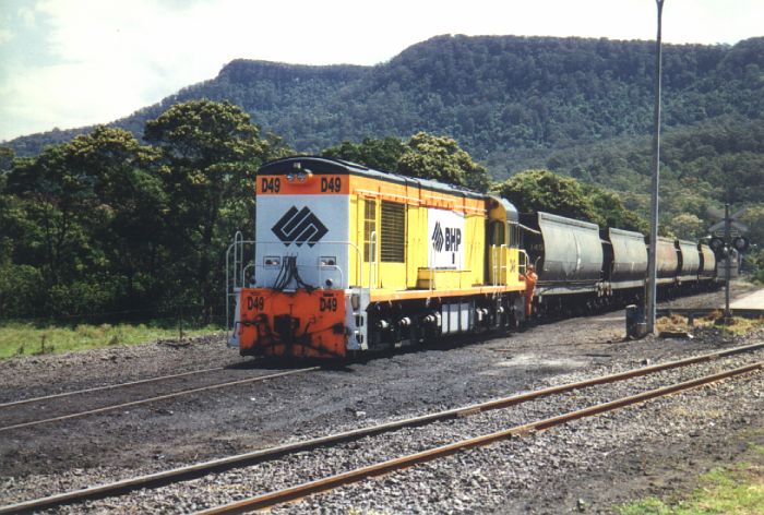 
Ex-Goldsworthy loco D49 (now withdrawn from service) begins the descent 
towards the main line with a loaded coal train.
