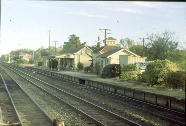 Bathed in the early morning light Gerogery prepares for another day of business, the Signal Box can be seen to the left of the name board and the storage shed was designed with vents at the top to help dissipate heat.