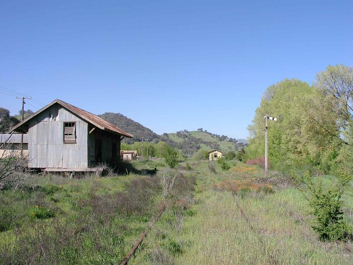 
The view looking back up the line through the yard, showing the goods shed
station building and semaphore signal.
