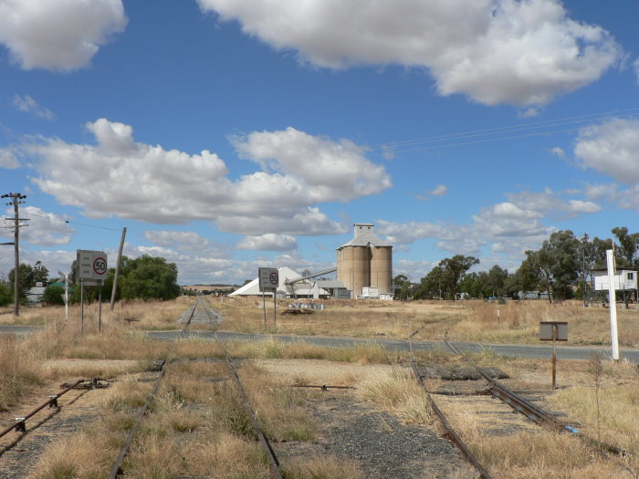 The view looking east. The former station was located byond the level crossong on the left hand side.