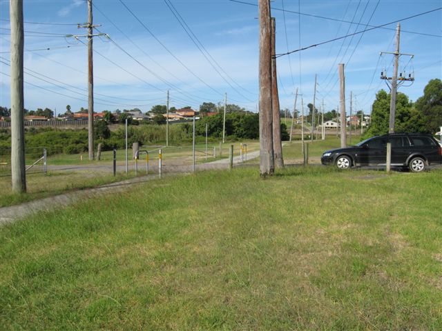 The view from Loma Street looking back towards the junction. The main line is hidden behind the bushes in the distance.