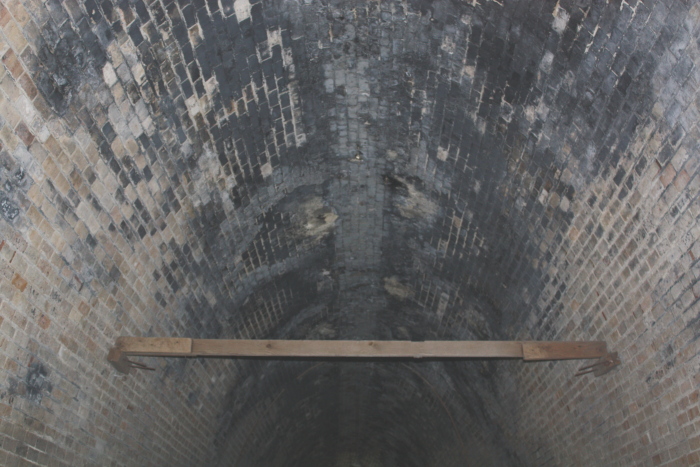 Some sort of brace or frame found in the tunnel.