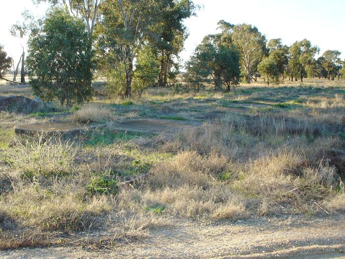 Only the concrete base remains of what may have been the goods shed.