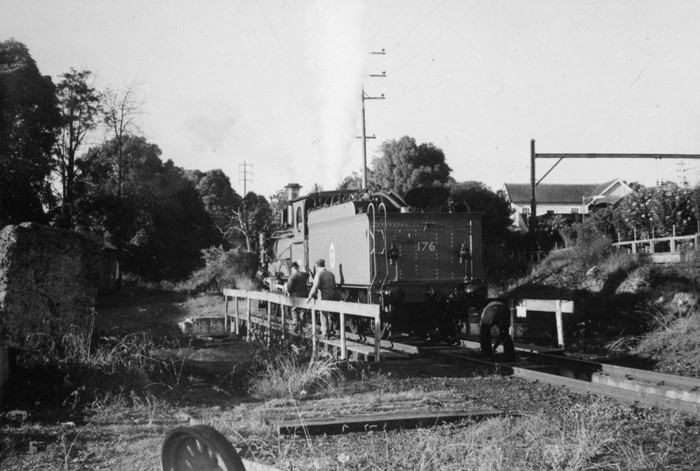 The turntable was located behind Platform No.1 (the Up Shore Platform). The occasion was the day of official photographs of the Vintage Train at Homebush Abattoirs. Locos 1243 and 1709 had run light engine to Hornsby to pick up the Vintage Cars that were stored in Hornsby Car Sheds. Loco 1243 (re-numbered 176) had just been turned on the turntable.

This location is now the eastern side commuter car park.