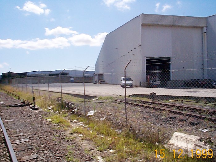 The APM siding view from within the corridor. One siding goes into the shed the other around across the concrete pad.