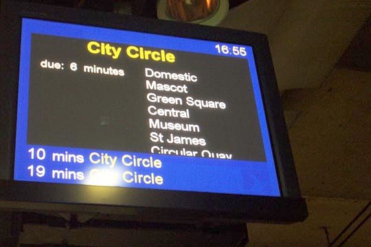 
One of the four train indicator boards on the station platform. Note that the
layout of the information and colour scheme on train indicator boards are
different to the indicator boards found on other train stations.
The names of the stations scroll up slower than the standard indicator boards,
perhaps to aid tourists.
