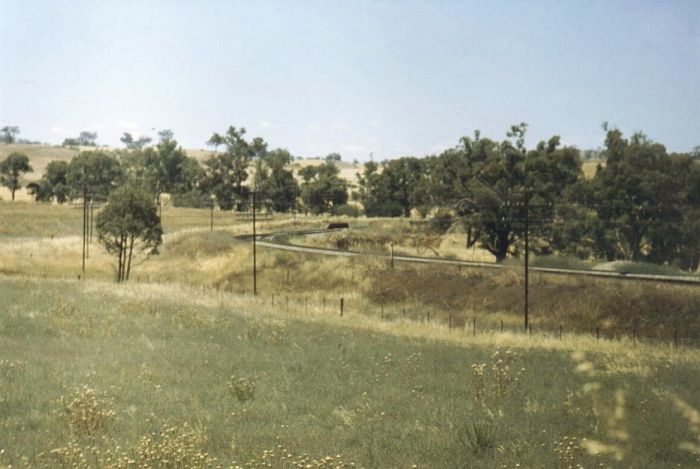 
The location of the one-time station at Jindalee.  The platform is
in the distance to the right of the curve.
