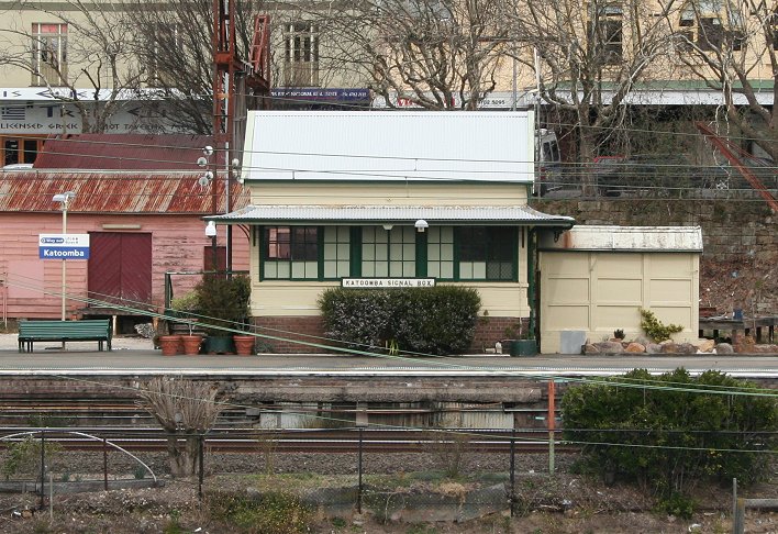 A view of Katoomba Signal Box taken from Great Western Highway looking south at the station. The old goods shed can be seen behind on the left of photo.