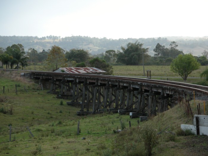 
Approaching Lismore crossing one of the wooden
trestle bridges that imposes severe speed restrictions on the line.
