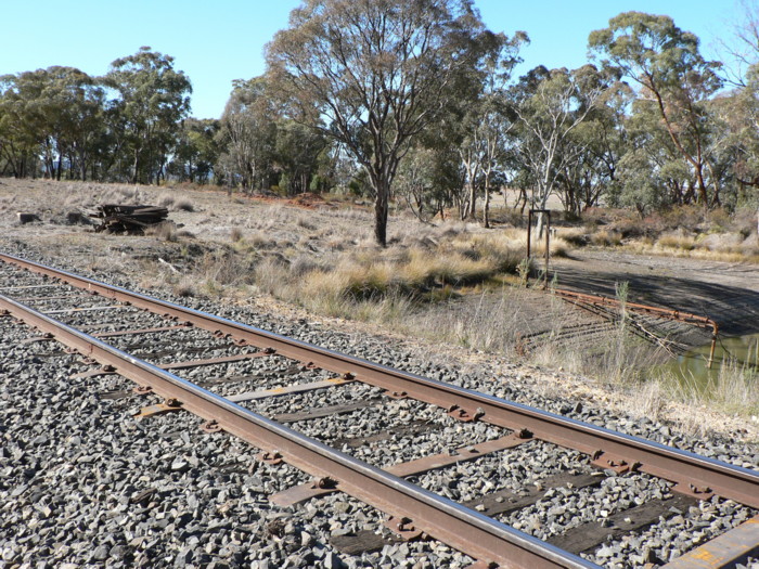 The foundations (far left) and dam that supplied the tank (right).