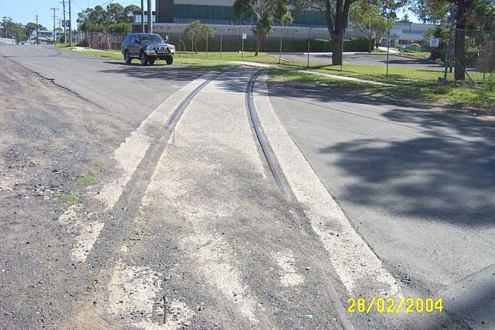 
The remains of an industral siding where it crossed a nearby road.
