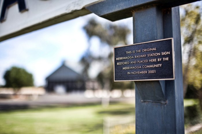 A plaque describing the preservation of the station name board.