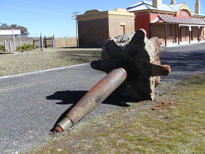 
An uprooted crane lying in the carpark.
