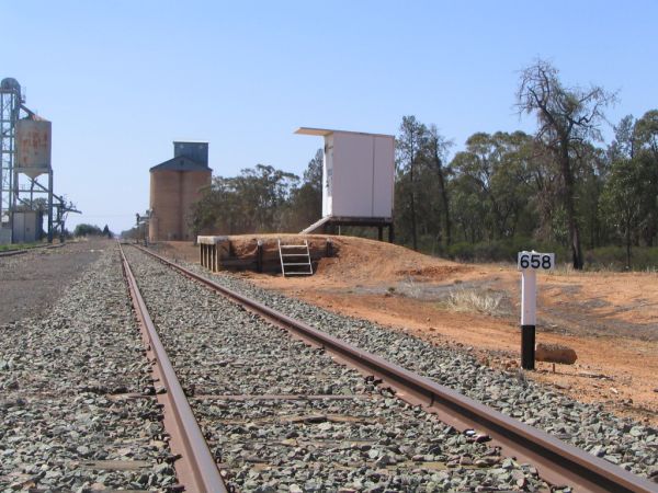 The staff hut, silos and distance marker looking east.