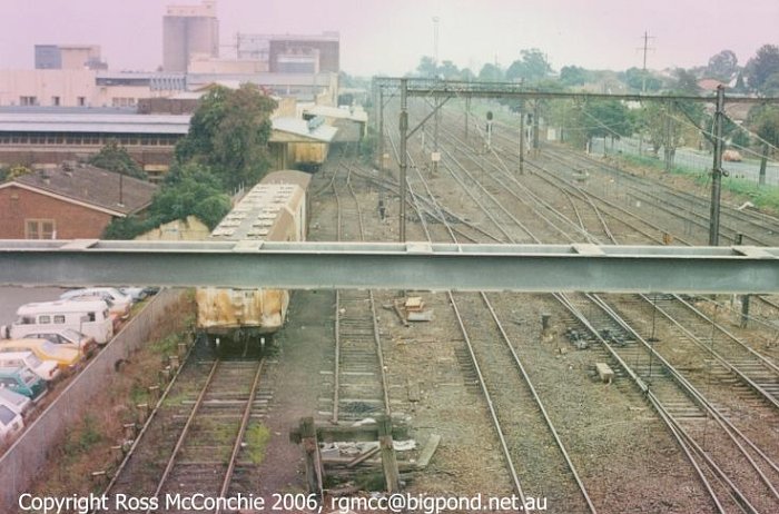 A view from the freeway overbridge of vans in the sidings for the Arnott's Biscuit factory.