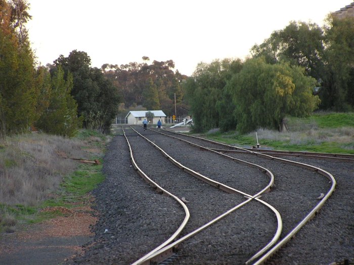 Close-up of Oaklands Station site, with locals clearing rubbish from the perway area.