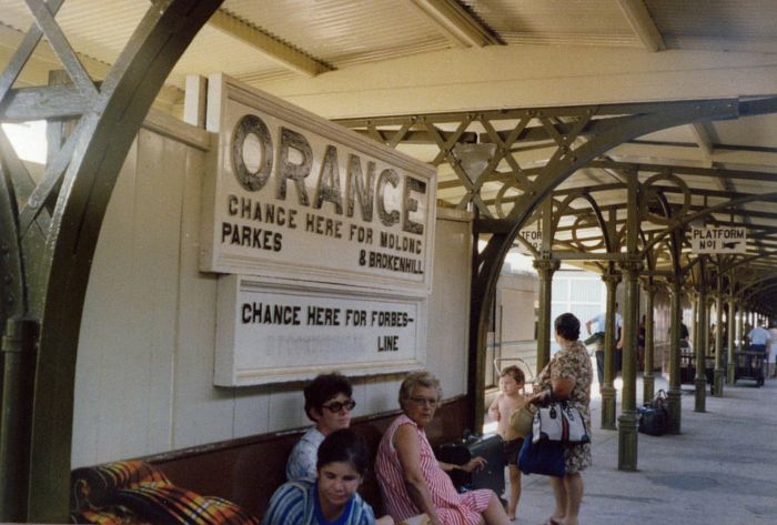 
Passengers wait under the ornate shelter roof at platform number 1.
