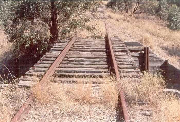 The view of the decking of the timber bridge looking towards Brocklesby.