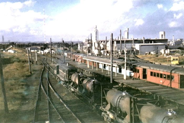 
A 48 shunts while a passenger train waits for workers.
