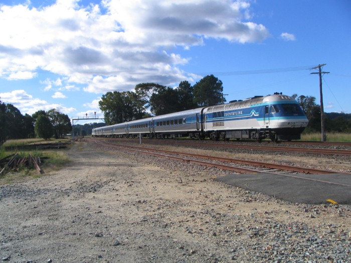 A southbound Countrylink service passes through Raleigh.