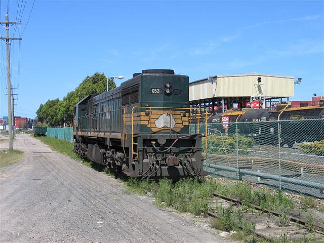 
A shutdown X53 loco sits outside the Shell refinery.
