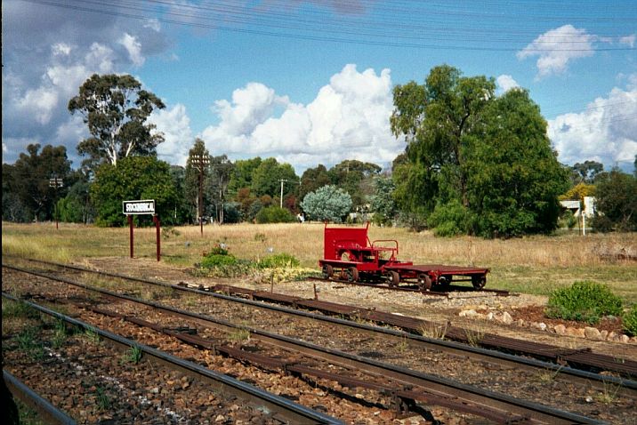 
A gangers' trolley sits on a short section of rail opposite the platform.
