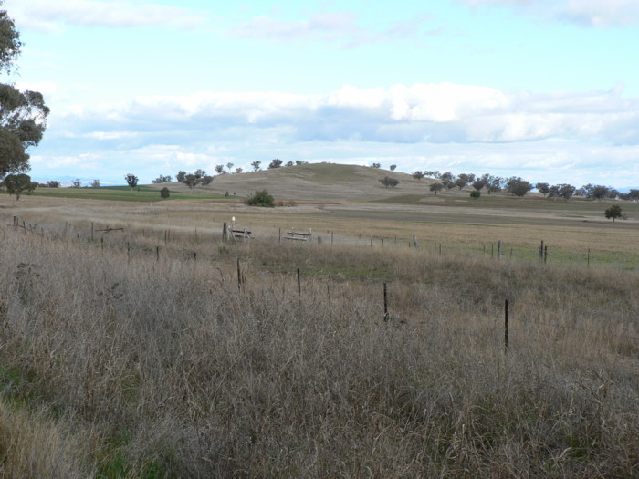 The view looking south as the formation curves in from the left to run parallel with the road.