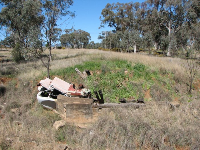 The remains of a small bridge on the siding. The formation beyond the bridge leads to the quarry, which is still in use.