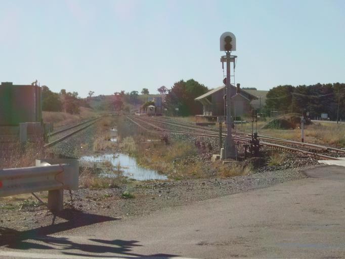 The view looking north from the level crossing to the goods shed and station.