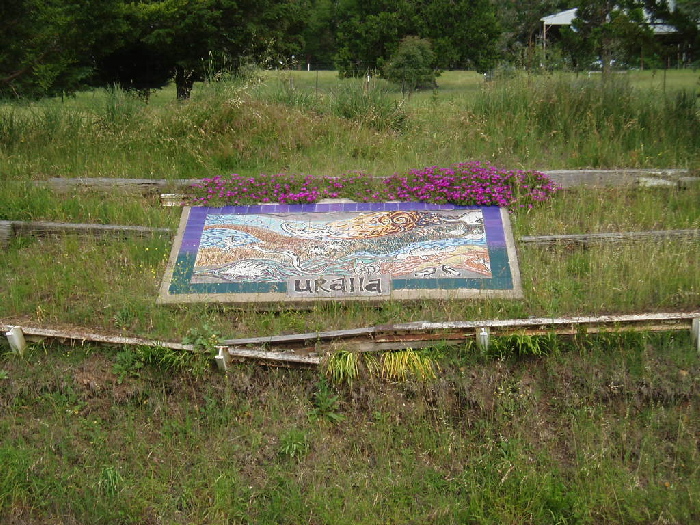 A mural on the bank opposite the platform.