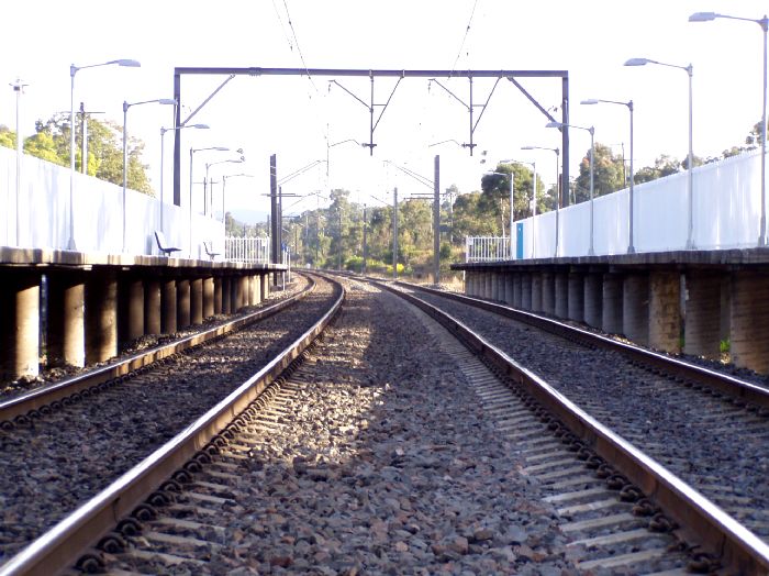 The view looking south from the level crossing towards Wyong.