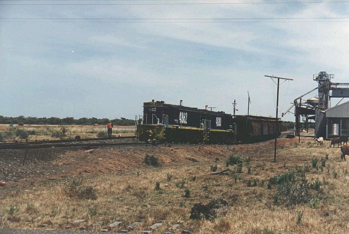 
4862 and 4880 have arrived to pick up some wheat wagons from the siding.
