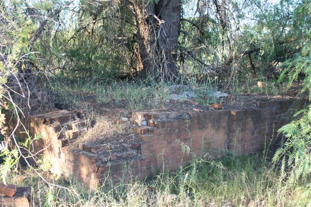 A closer-up of the decaying brick foundations.