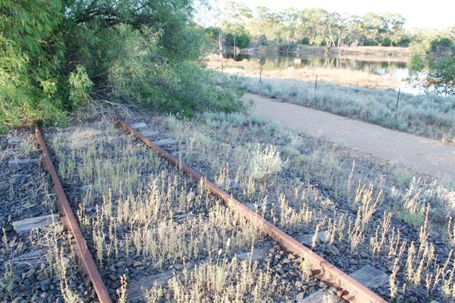 The view looking along the track towards Bourke.  The reservoir in the distance served the one-time watering facility.