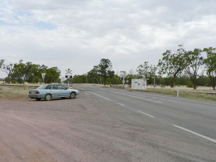 The view looking south of the level crossing and adjacent control hut.