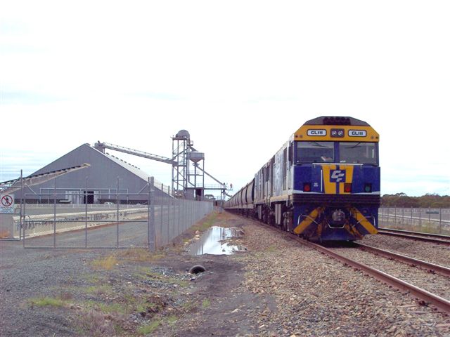 GL111/GL102 in charge of a wheat train loading the last season's harvest.